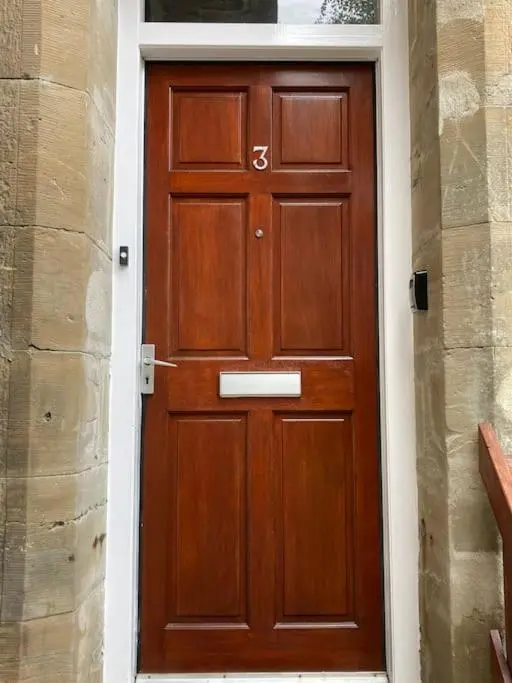 a wooden door with a number on it at One bedroom Flat in Dingwall in Dingwall