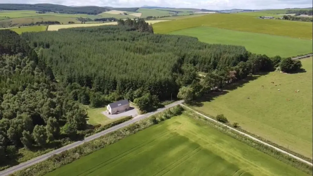 an aerial view of a farm with a barn at The Clearing in Huntly