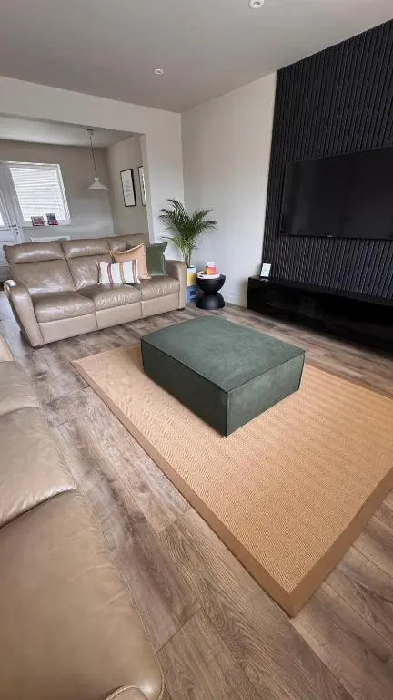 a living room with a couch and a coffee table at No 67 West Road in Fraserburgh