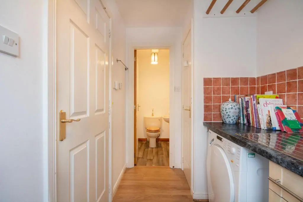 a kitchen with a washer and dryer in a room at Boutique Four Bed Holiday Home in Inverness in Inverness