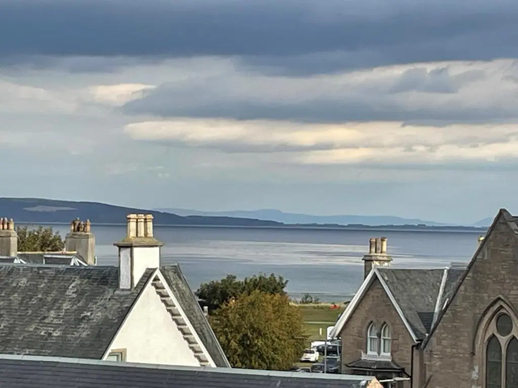 a view of the water from roofs of houses at Calailan Highland Seaside Retreat - Nairn in Nairn
