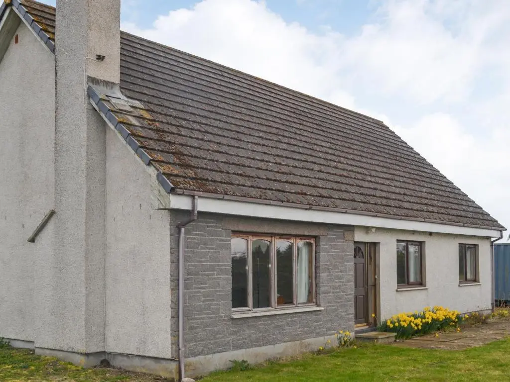 a small house with a gray roof at The Junipers in Tain
