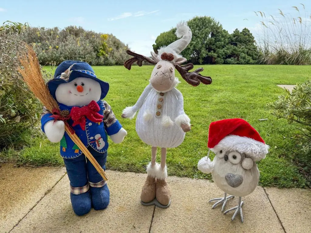 a group of stuffed animals sitting on a sidewalk at No4 The Links Apartments in Brora