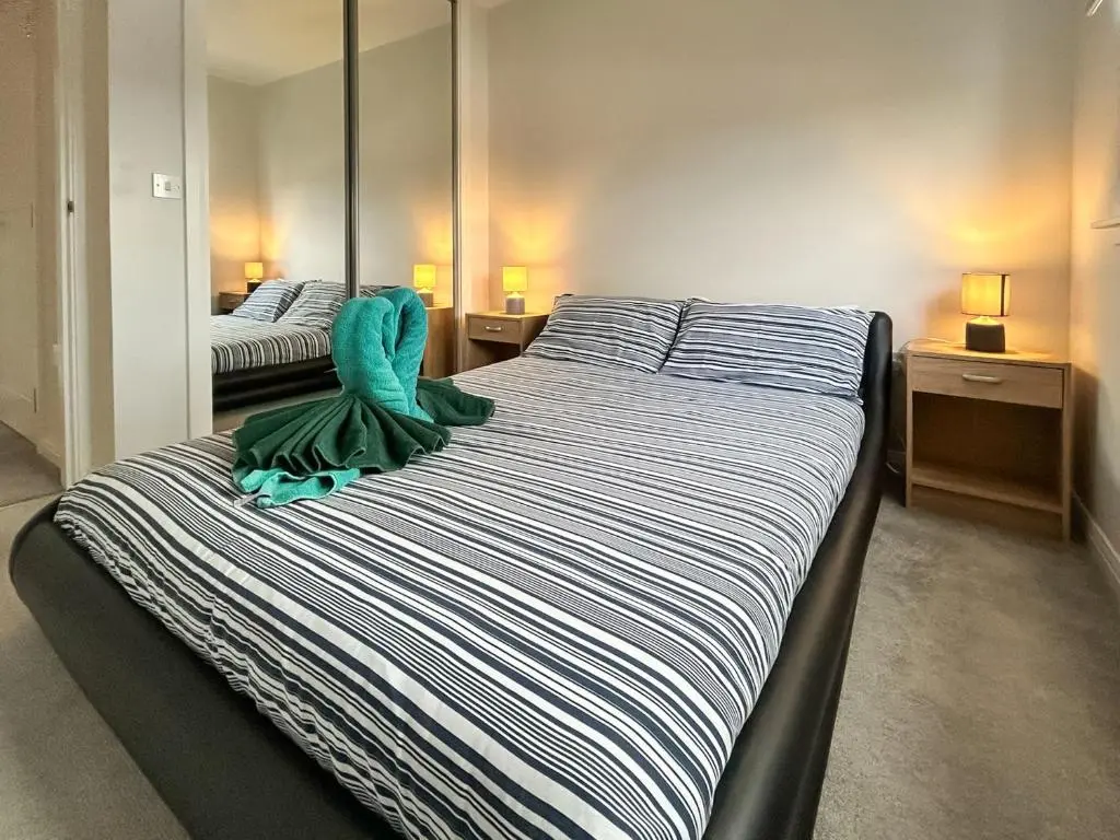 a bedroom with two beds with towels on them at Faillie in Inverness