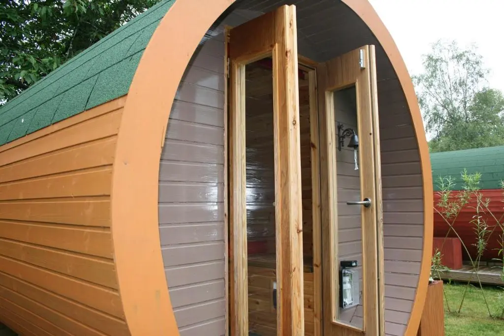 an arched entrance to a dome tent with a door at BCC Lochness Hostel pods in Bearnock