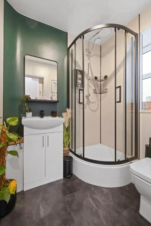 a bathroom with a shower and a sink at Ramsay Lane in Lossiemouth