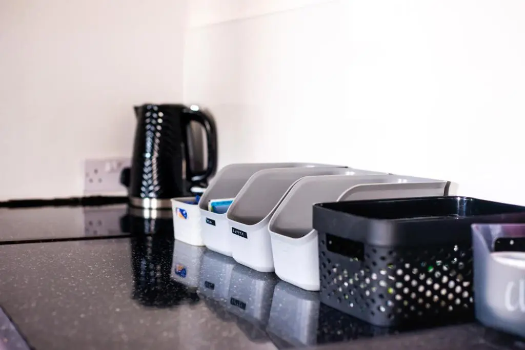 a kitchen counter with fourquart appliances on a counter top at Weston House in Keith