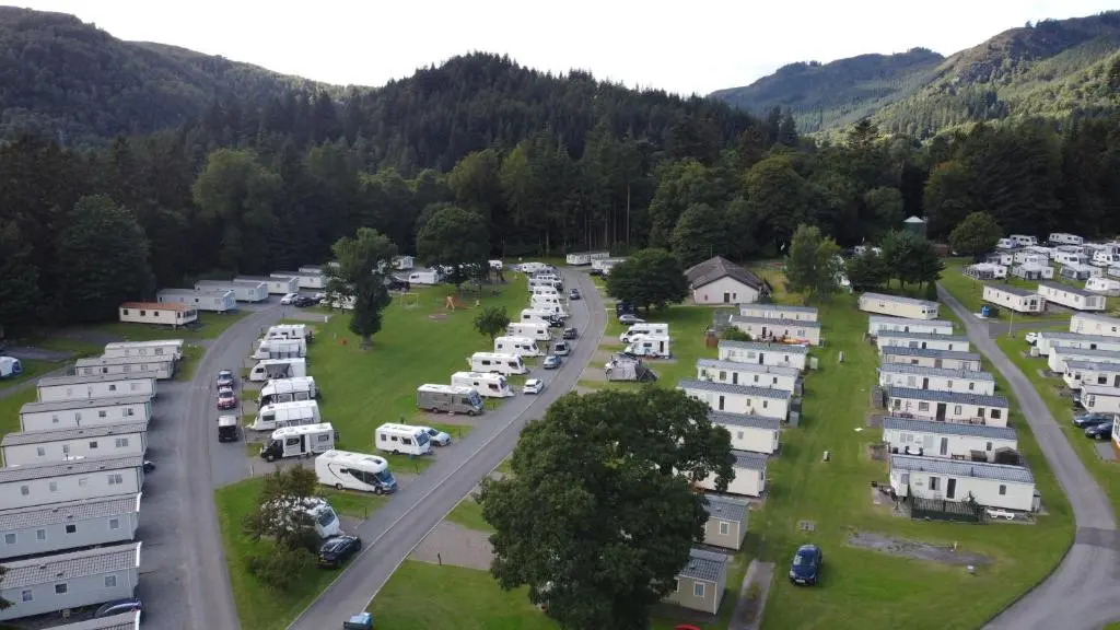 an aerial view of a parking lot with parked vehicles at Faskally Woods Holiday Park in Pitlochry