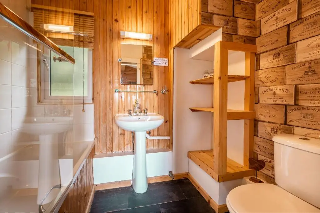 a bathroom with a sink and a toilet at Ancarraig Lodges in Drumnadrochit