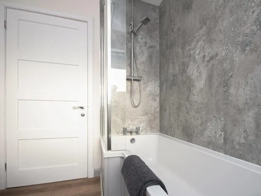 a bathroom with a shower and a bath tub at View Apartment in Inverness