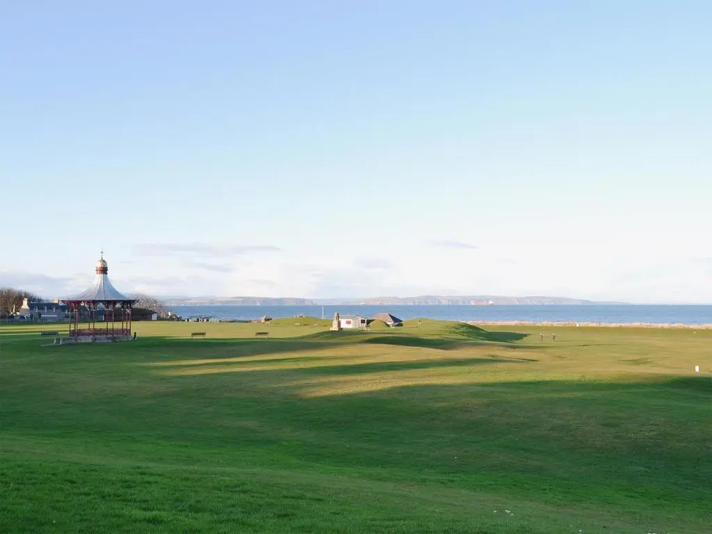 a view of a golf course with a gazebo at Dolphin Cottage in Nairn