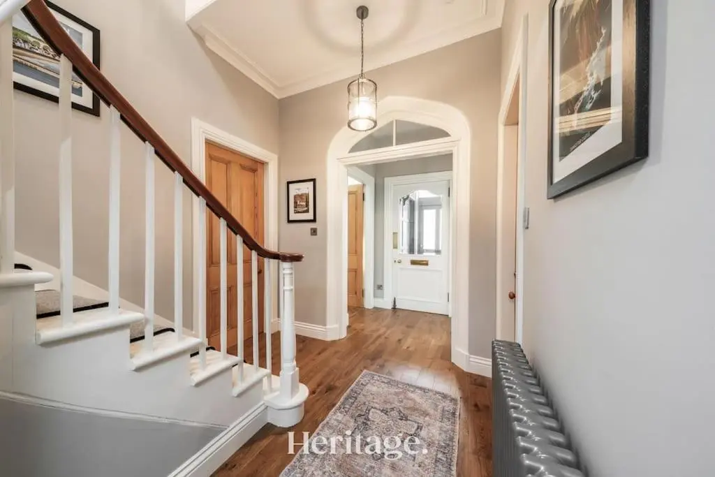 a hallway of a home with stairs and a stair case at Blythewood Aberdeenshire Luxury Lodge with Hot Tub in Kemnay