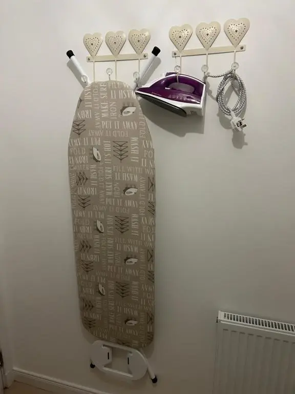 a suitcase sitting on a wall with a chain and a watch at Inverness Retreat in Inverness