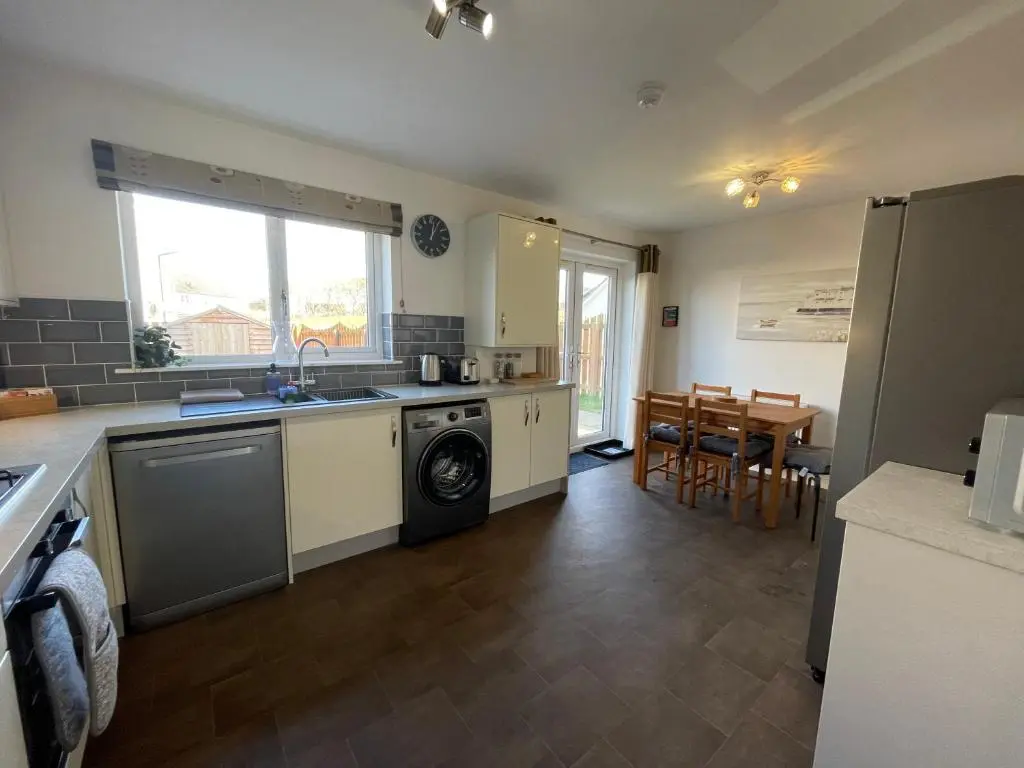 a kitchen with a sink and a dishwasher at Inverness Retreat in Inverness