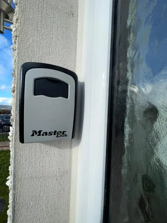a black and white door latch on a window at Inverness Retreat in Inverness