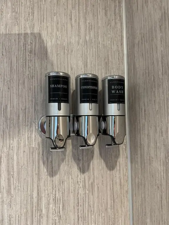 three coffee cups are hanging on a wall at Firth View Heights in Inverness