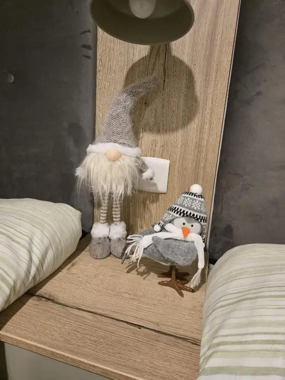 a shelf with stuffed animals on top of a bed at Lynmar retreat No 35 in Dornoch