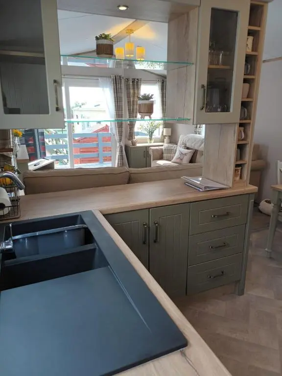 a kitchen with a sink and a counter top at Lynmar retreat No 35 in Dornoch