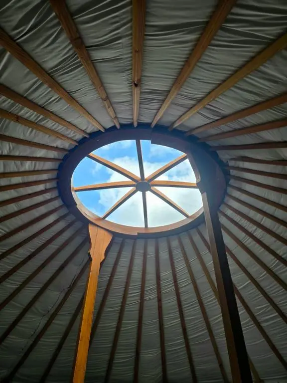 a round window in a metal roof at Rainbow's End Yurts in Dornoch
