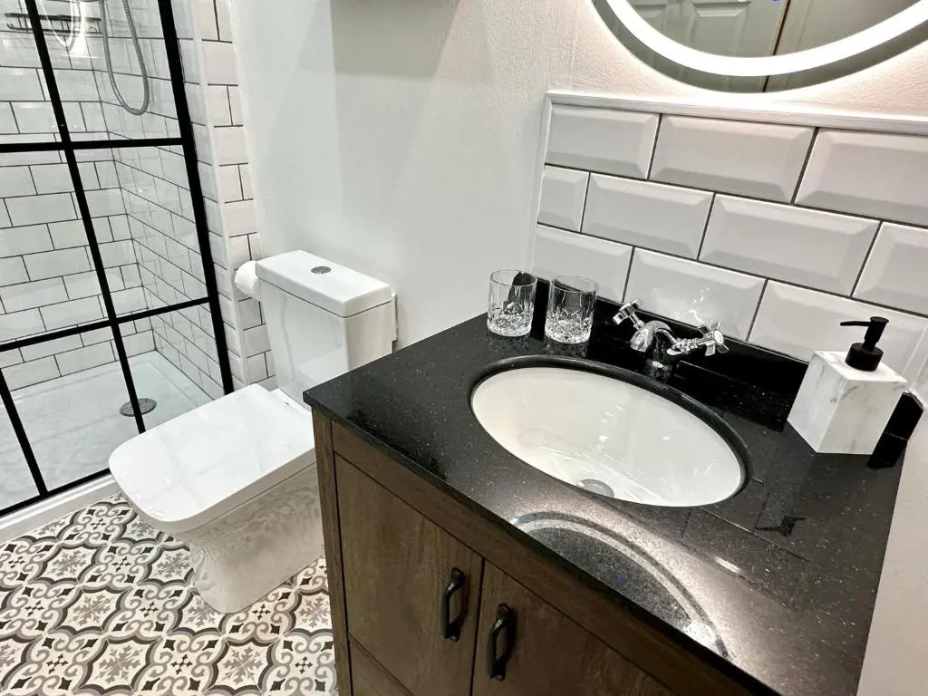 a bathroom with a sink and a toilet at Beechtree Cottage, Ardle Family Room, Kirkmichael in Kirkmichael
