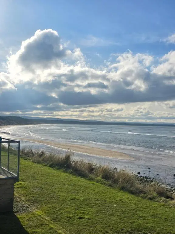 a view of a beach with the ocean at Clearwater View - Stunning sea views from large deck in Burghead