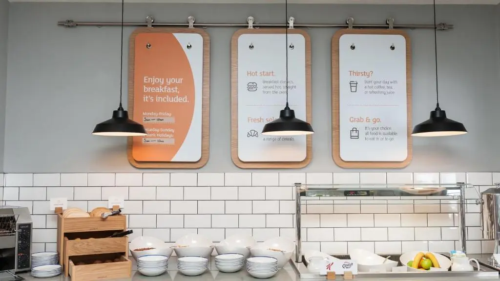 a kitchen with several signs hanging on the wall at Holiday Inn Express Aberdeen Airport by IHG in Dyce