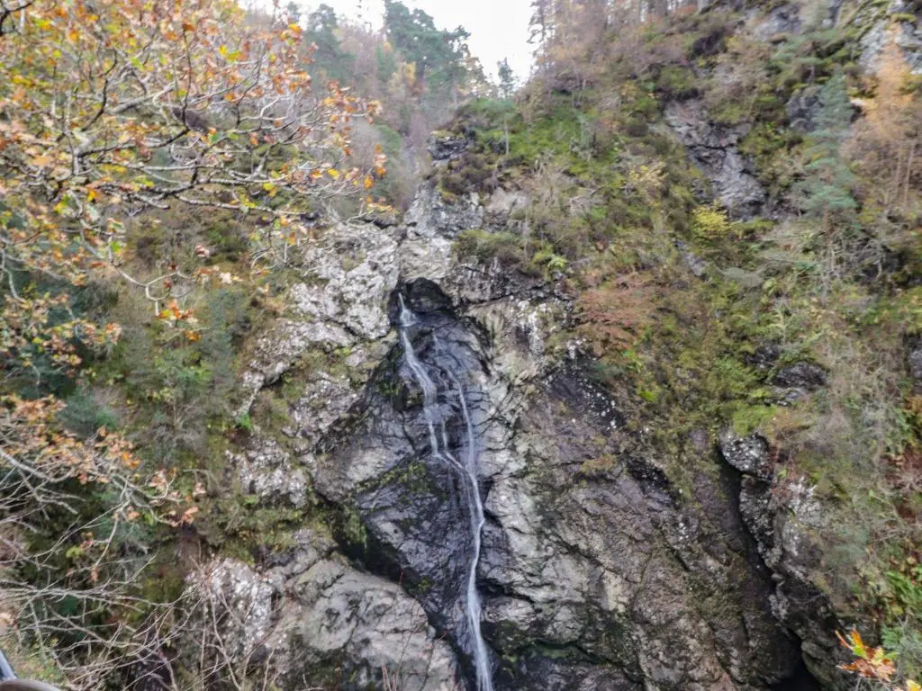 a waterfall on the side of a mountain at Wendy's Place in Inverness