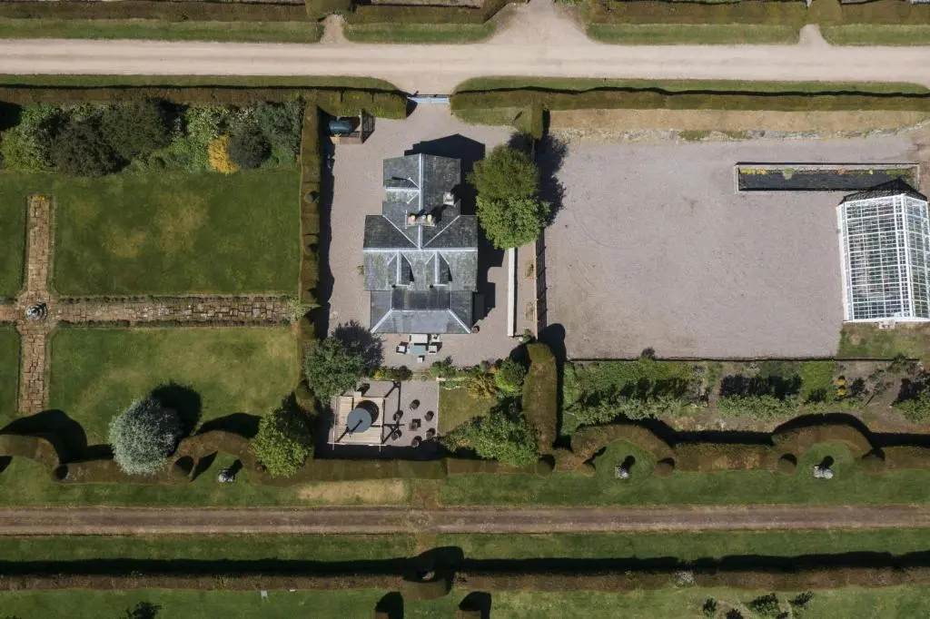 an aerial view of a house with a yard at Garden Cottage in Inverness