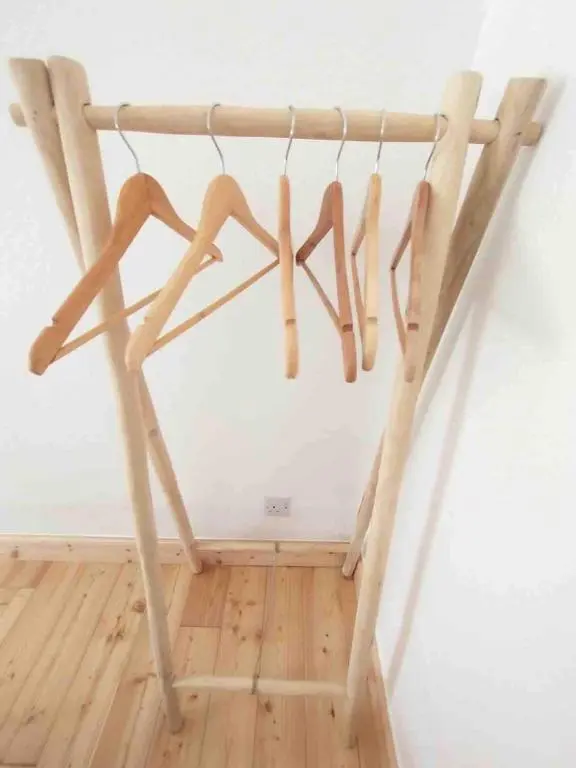 a group of wooden sticks hanging from a wall at River Retreat - Riverside Apartment in Inverness City Centre in Inverness