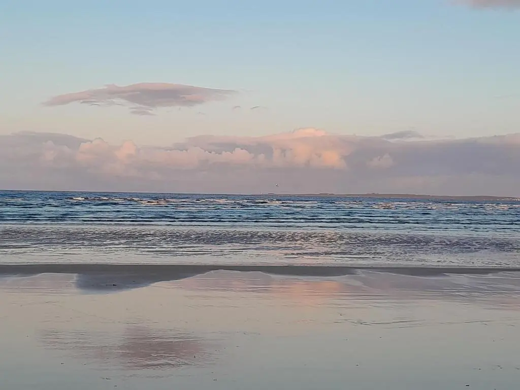 a view of the ocean from the beach at No1Dornoch in Dornoch