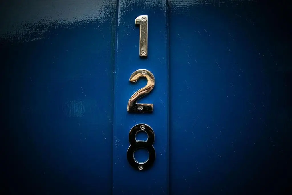 a blue door with a number on it at Castle Grant - 4 Bed Cottage in Gardenstown in Gardenstown