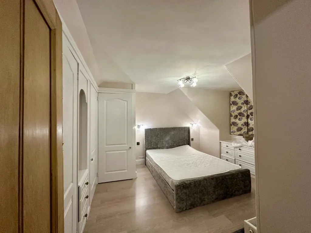 a small bedroom with a bed and a dresser at 3 Bed Cottage Sleeps 2 with Parking Garden & Wifi in Aberdeen
