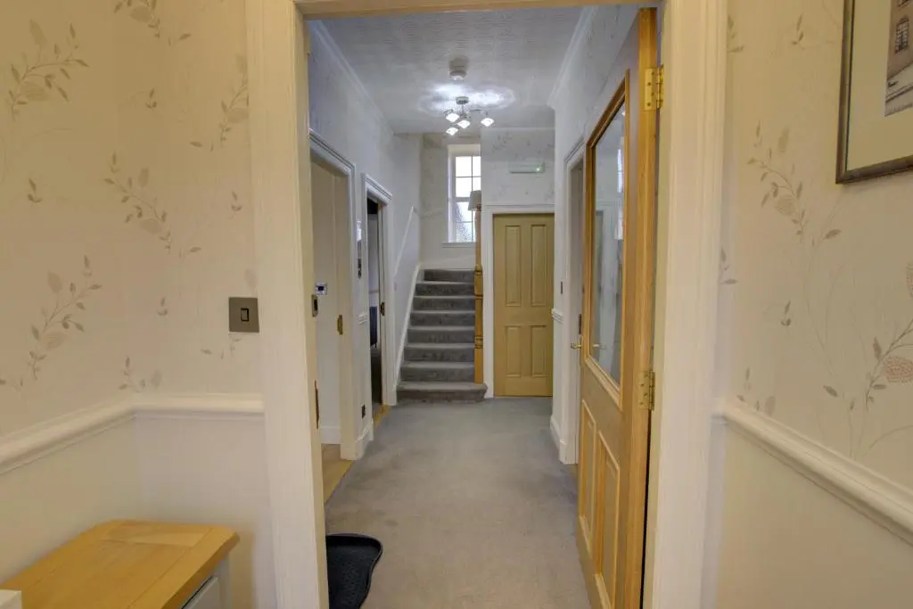 a hallway with a staircase in a house at The Clachan, Wick in Wick