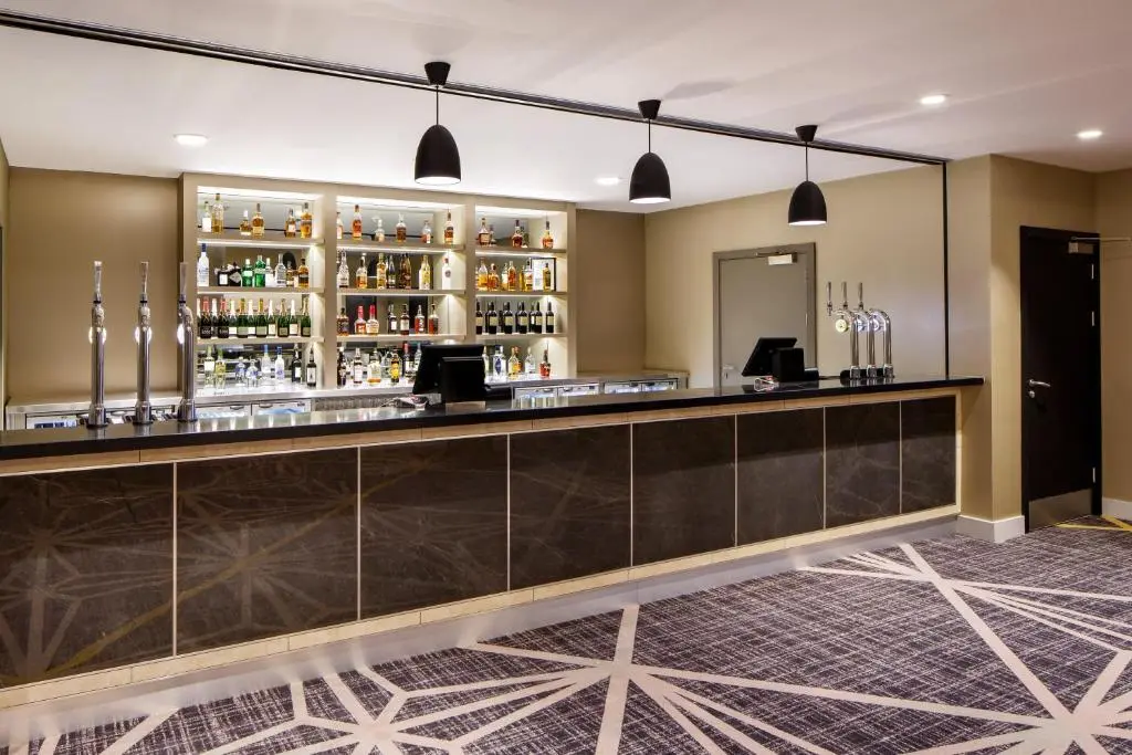 a bar in the lobby of a hotel at Crowne Plaza Aberdeen Airport by IHG in Dyce