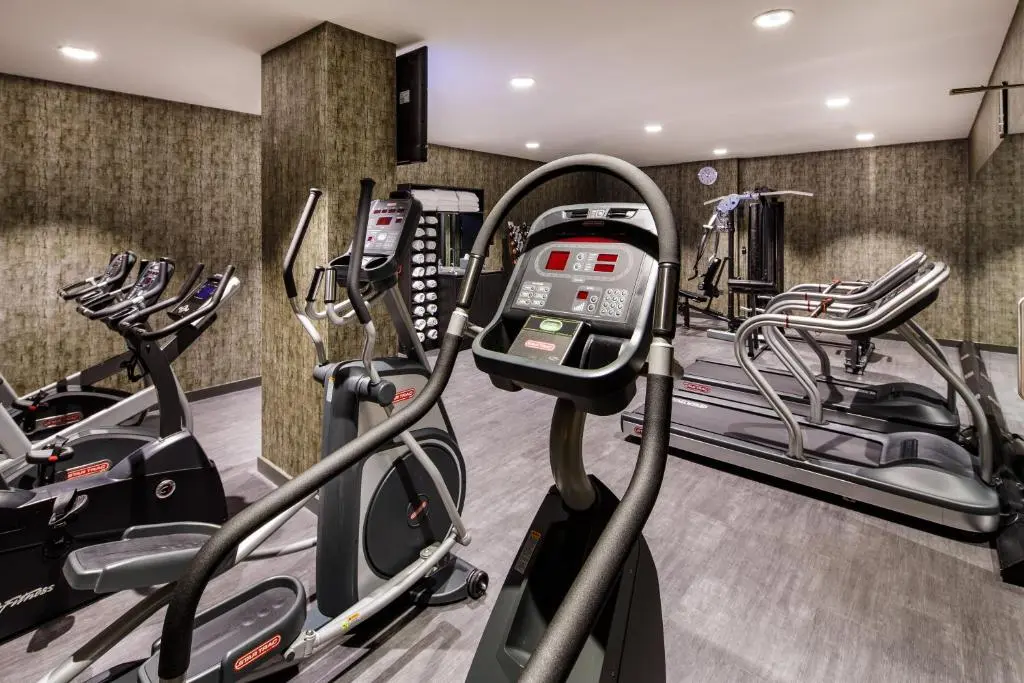 a gym with treadmills and elliptical machines at Crowne Plaza Aberdeen Airport by IHG in Dyce