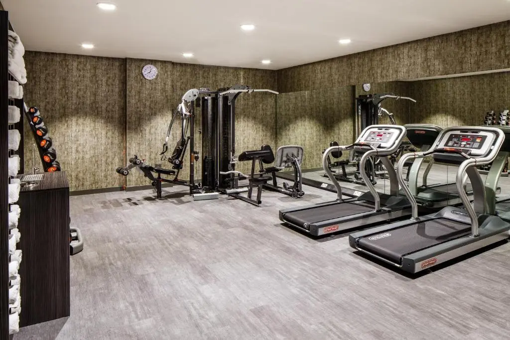 a gym with treadmills and elliptical machines at Crowne Plaza Aberdeen Airport by IHG in Dyce