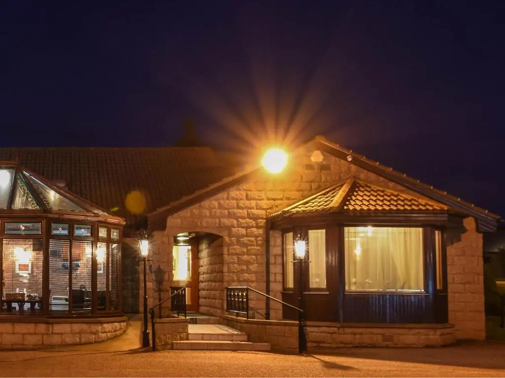 a house with a light on top of it at night at Findlay's in Fraserburgh
