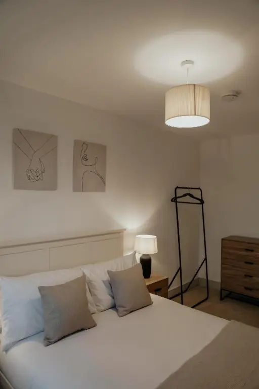 a white bed with two pillows in a bedroom at Luxurious Apartment in Inverness in Inverness