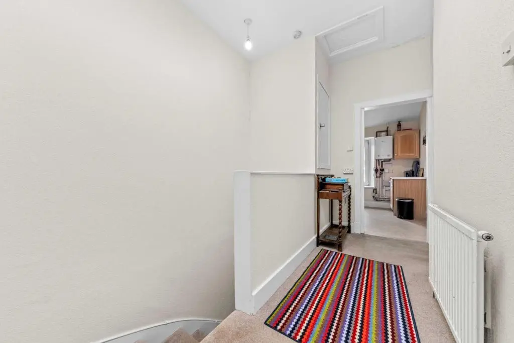 a hallway with a colorful rug on the floor at Central 1 Bedroom Apartment - Inverness in Inverness