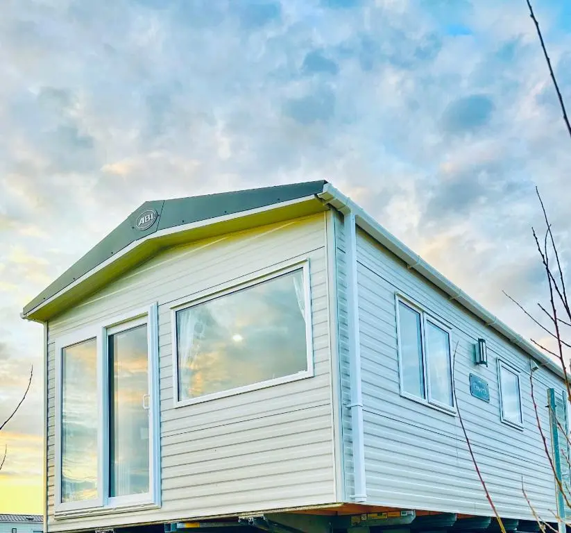 a tiny house sitting on top of a trailer at Silver Dunes in Lossiemouth