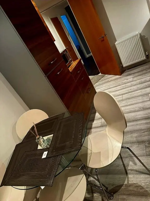 a room with two chairs and a table and a desk at Luxury 2 bedroom apartment in Aberdeen in Kirkton of Skene