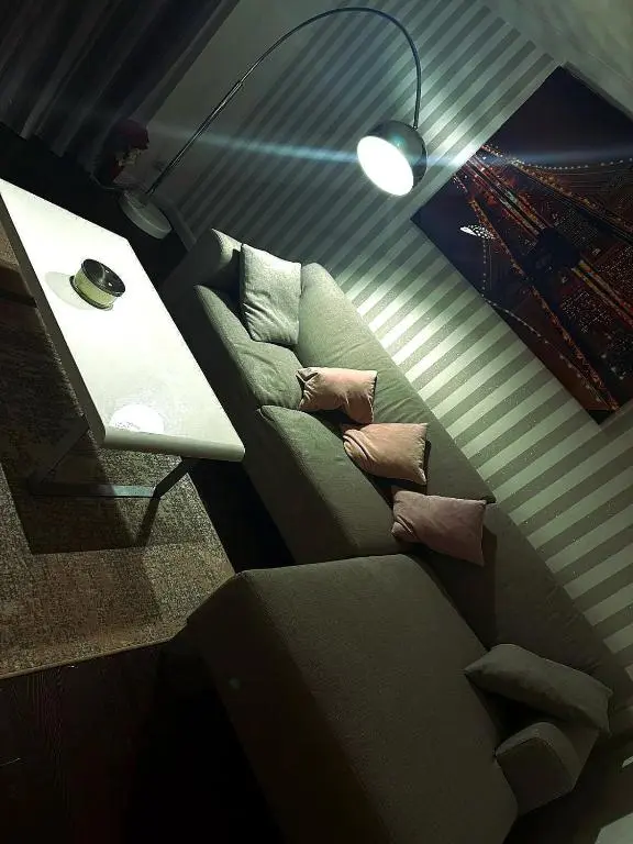 a living room with a couch and a table at Luxury 2 bedroom apartment in Aberdeen in Kirkton of Skene