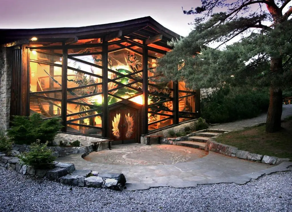 a glass house with a fire pit in front of it at Findhorn Bay - Mobile Holiday Homes in Findhorn