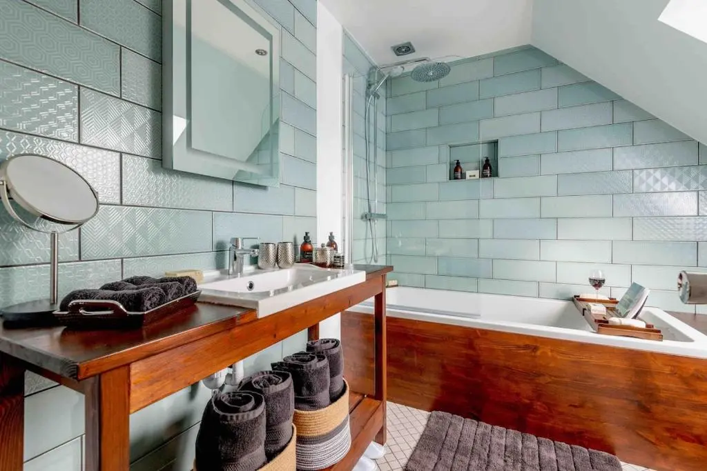 a bathroom with a sink and a bath tub at An I\u00f9bhrach in Inverness