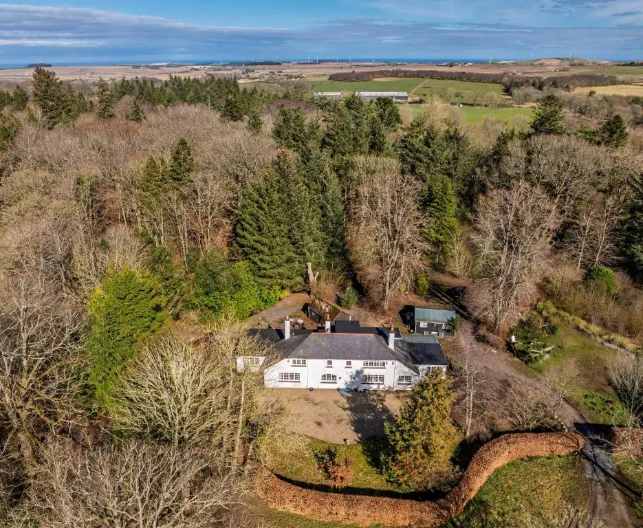 an aerial view of a white house in the woods at Finest Retreats - White House Retreat in Cornhill