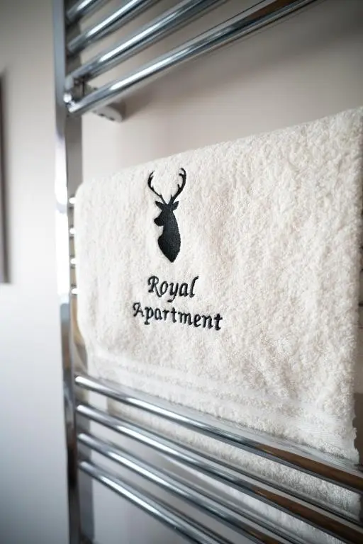a sign that says royal equipment on the side of a refrigerator at Royal Apartment in Inverness
