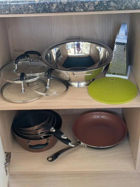 a kitchen drawer with a sink and some pans at Dune Haven Luxury Beachside Lodge in Lossiemouth