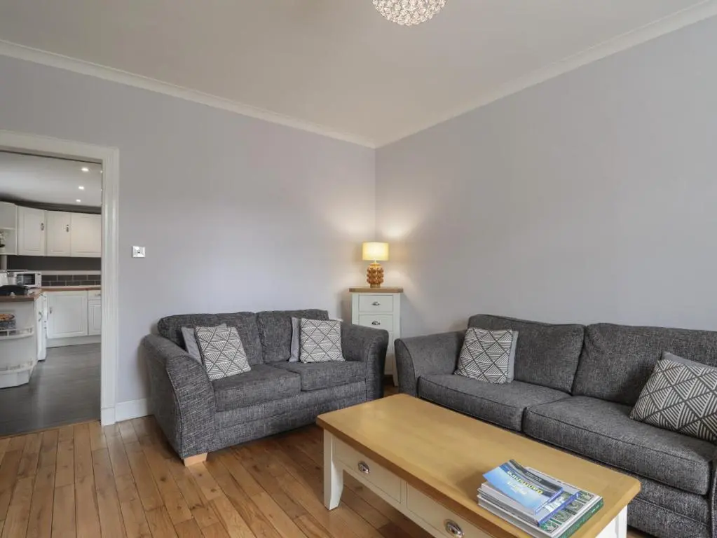 a living room with two couches and a coffee table at 6 New Street in Elgin