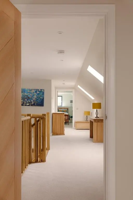 a hallway of a hospital with a room with aocratesknifeknifeknife at Elrick Estate - Coach House in Newmachar