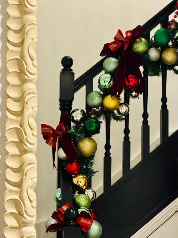 a stair railing with christmas ornaments on it at Inchmarlo Villa 29 Banchory in Inchmarlo